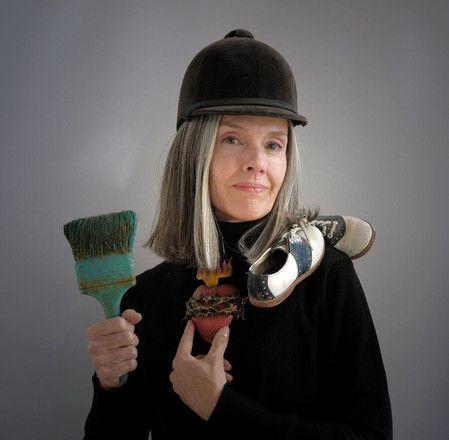 Woman holding brush with dalmatiam face